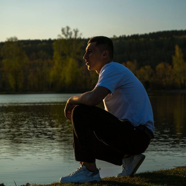 Silhouette of a focused man in a meditative state with energy lines.